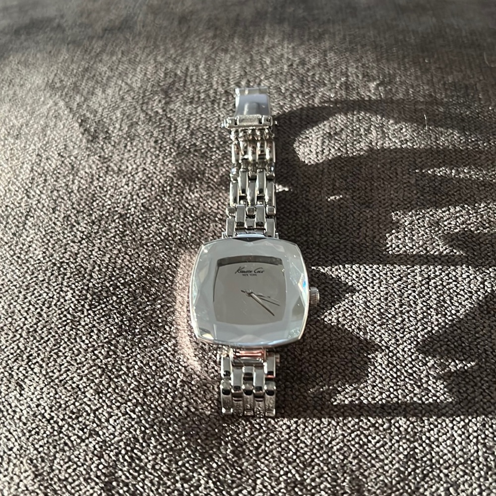 Kenneth Cole silver watch.